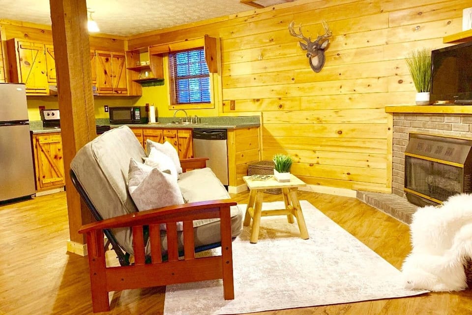Open studio layout with queen bed + fold out couch + dinette