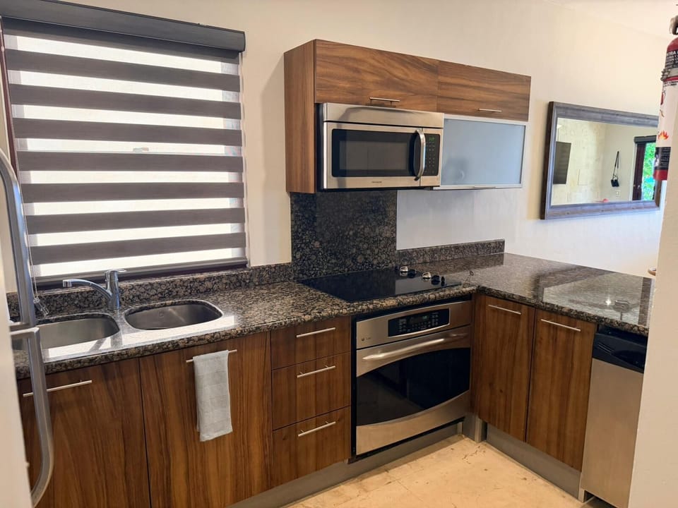 Fully equipped kitchen with modern appliances.