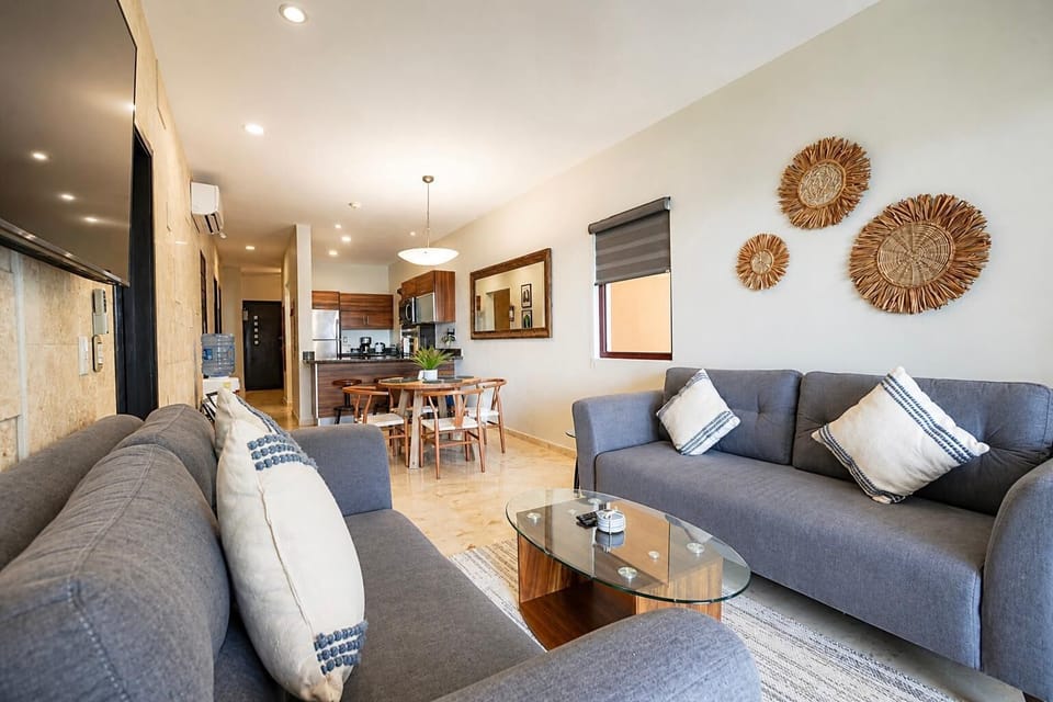 Stylish living area with cozy seating and warm decor.
