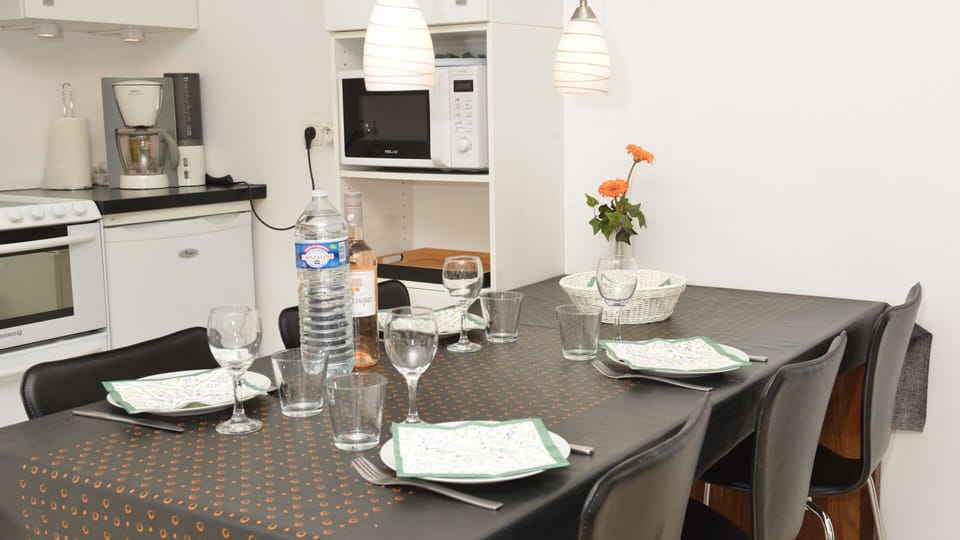 Internal dining located between kitchen and living room.