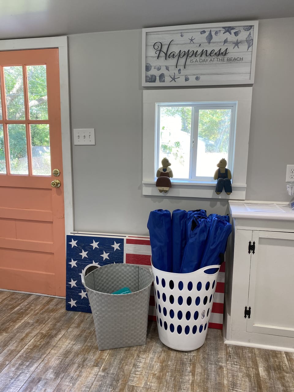 Beach chairs, beach towels, cornhole game for guests
