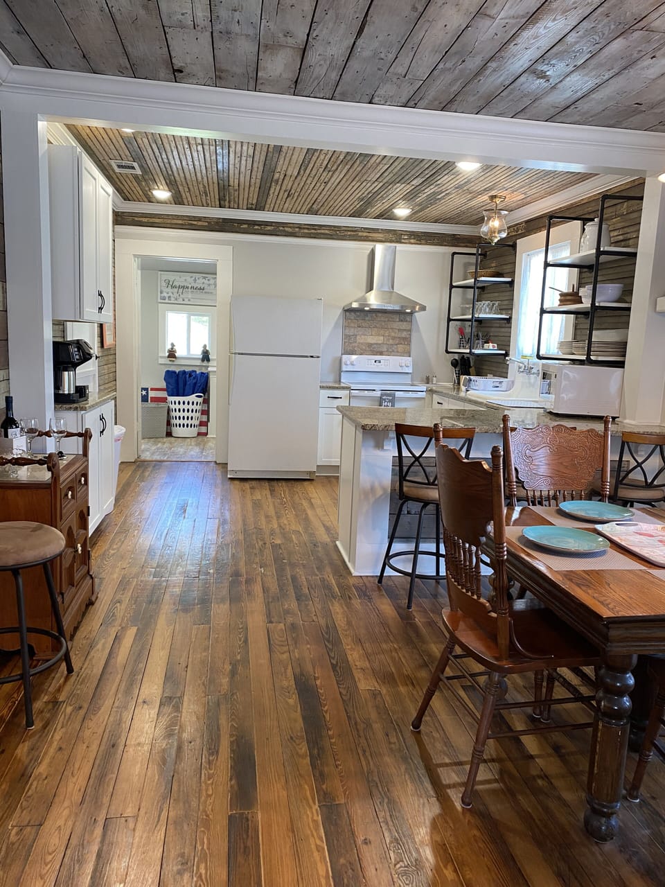 Open floor layout with living room, dining room and kitchen