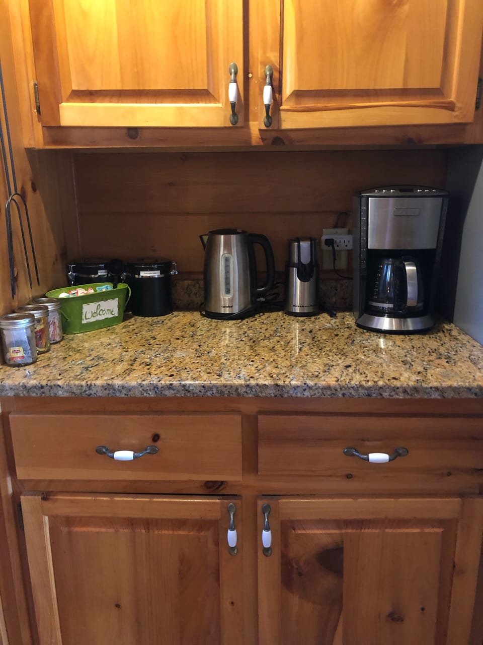 The cabin is stocked with coffee, tea, sugar, and creamers. 