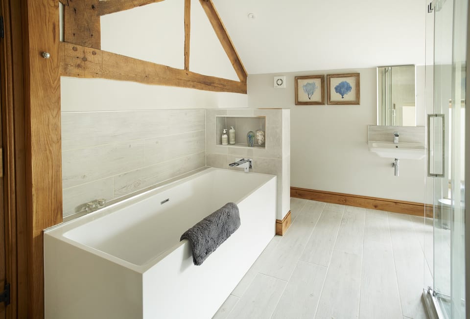 First floor: En-suite bathroom with bath and separate shower