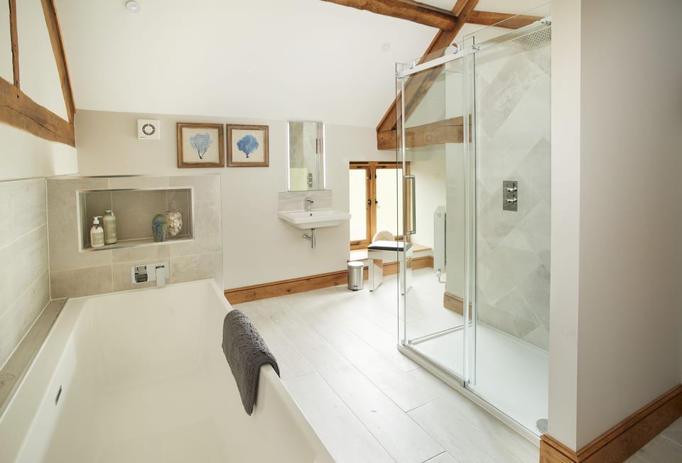 First floor: Bathroom with bath and separate walk-in shower