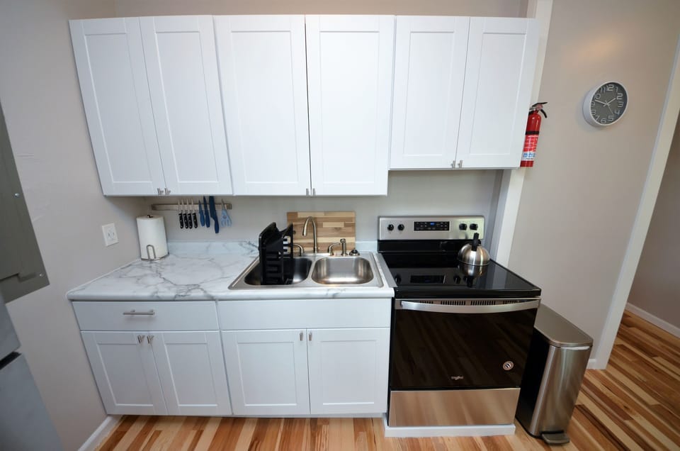 Kitchen Stocked With Everything One Would Need To Prepare And Serve A Meal
