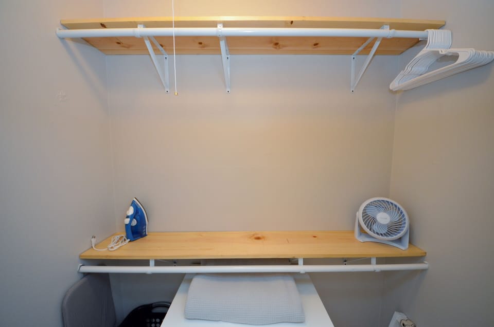 Bedroom With A King Sized Bed, Walk In Closet And 32" Vizio Smart TV