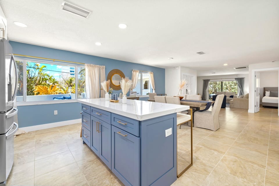 Spacious open floor plan with full kitchen, island seating, and cozy dining area—perfect for relaxing or entertaining.