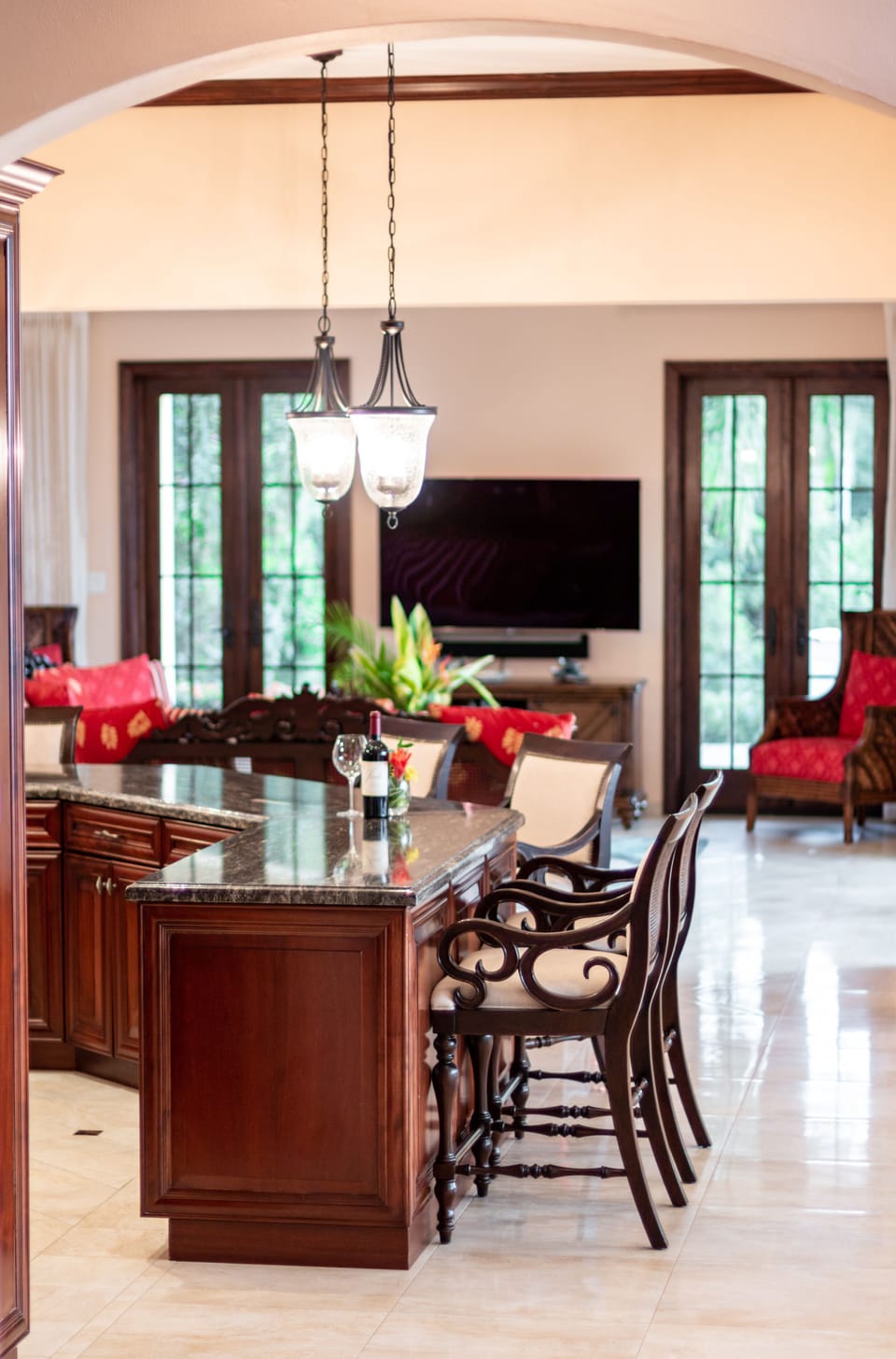 Relax at the breakfast bar and look through the living room onto the patio area.