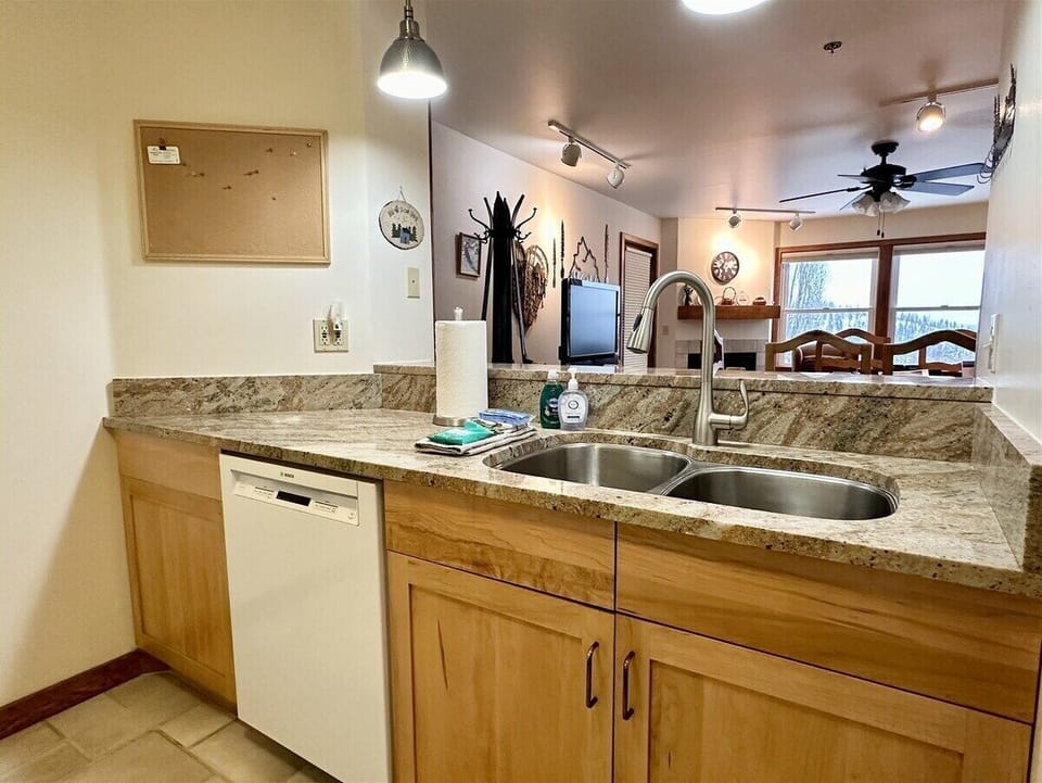 Kitchen overlooking breakfast bar and into the dining and living room