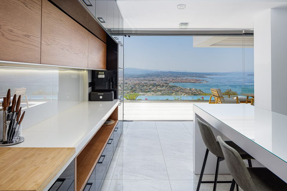 Floor to ceiling glass doors keep the interior sunny and airy all day long!