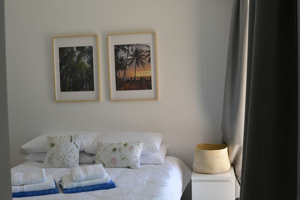 bedroom with queen sized bed and en-suite bathroom