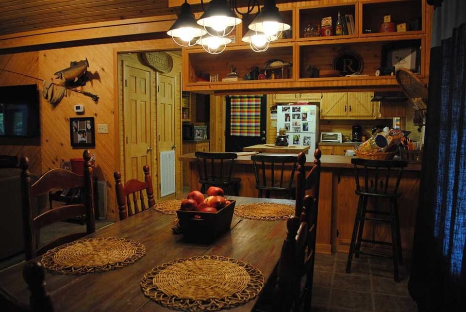 Our dining area offers lots of room at the farmhouse table or bar.