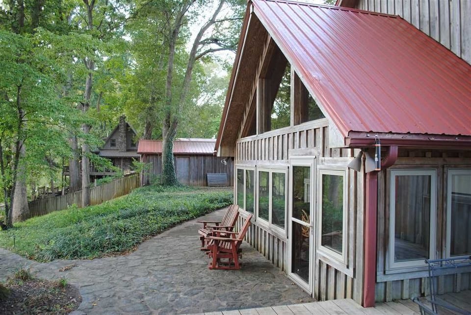 The back porch offers a great view of the yard and the Little Red.