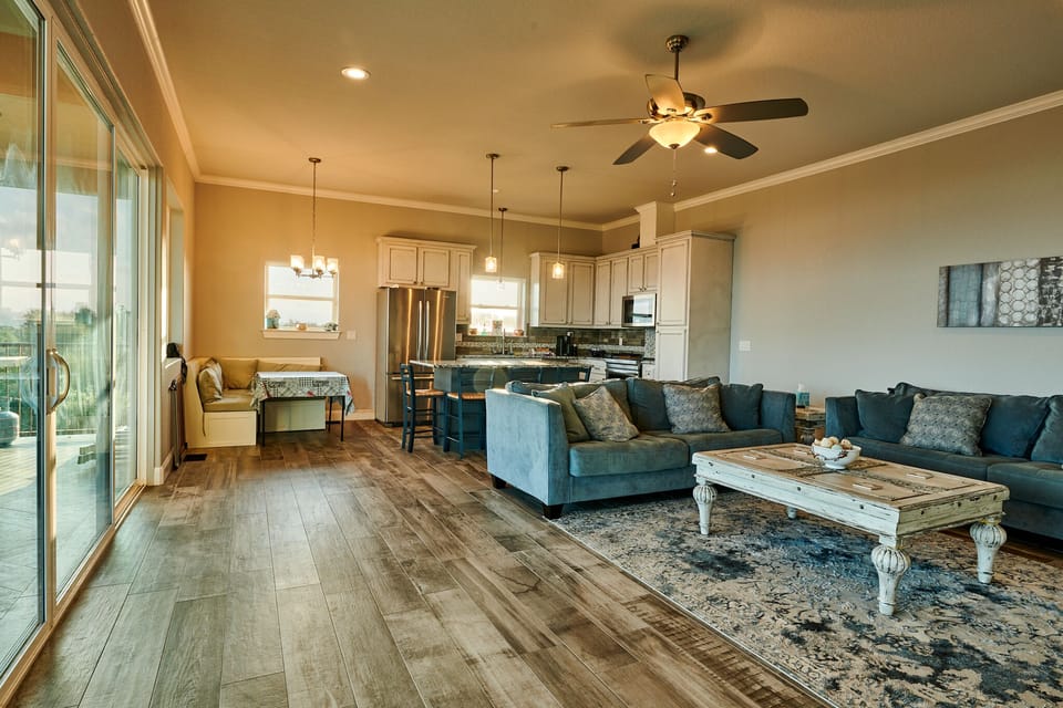 Open concept living, dining, and kitchen.
Photo by Carmel Studios Photography