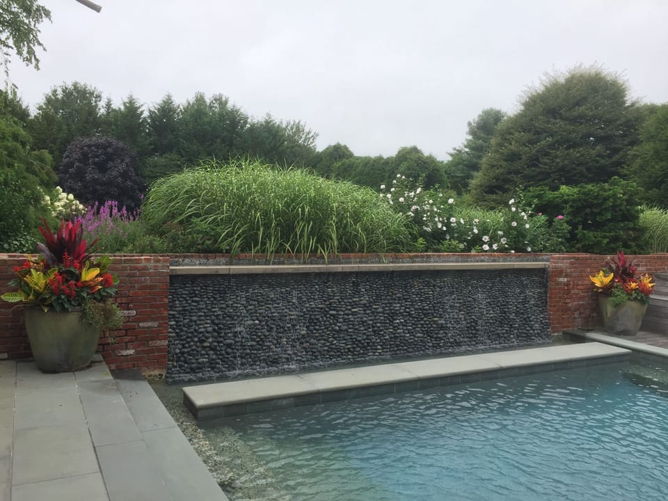 Beautiful, Large Heated Pool and Waterfall Surrounded by Lush Gardens