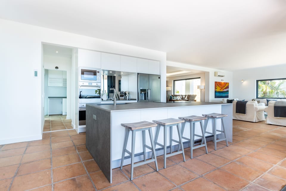Cook, converse or enjoy a tipple at the social kitchen island. 