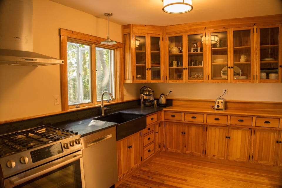 The kitchen is well stocked for cooking meals or enjoy the gas grill out back.
