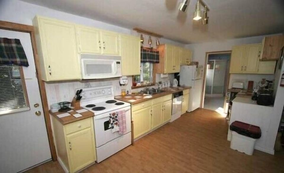 Full working kitchen with tons of room for the chef. Full family barbecue just off the kitchen area.