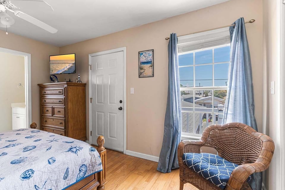 Cozy bedroom with sunny window and charming decor
