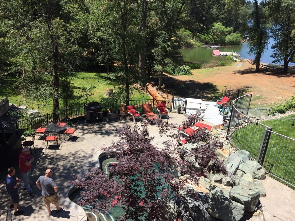 View of the pool and dock from the deck. 