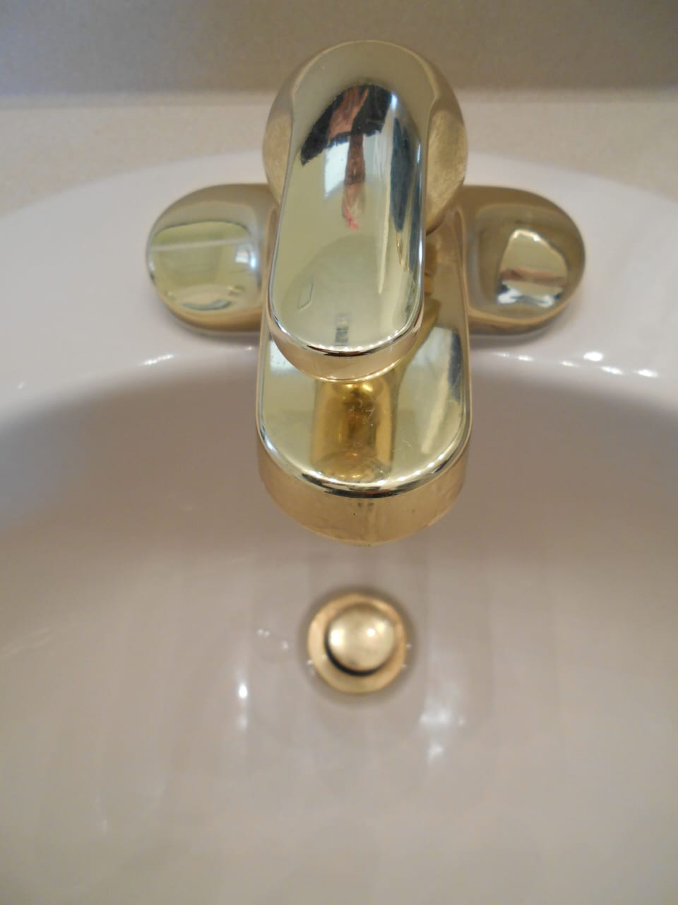 Luxury touches include gold fixtures in powder room (bath #3).