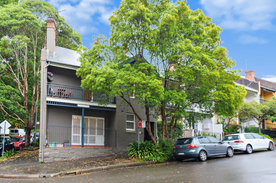 Street view of apartment which is on the upper level.