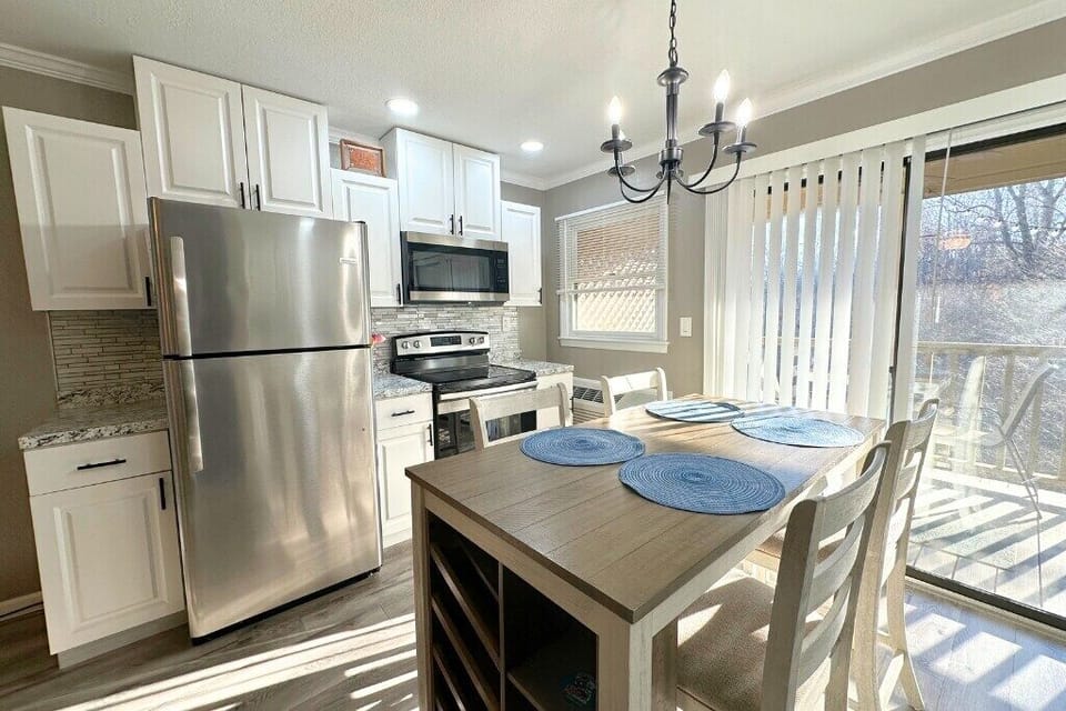 Updated kitchenette with full-size stainless steel appliances.