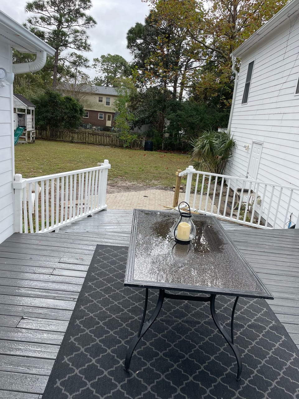 Large fenced in backyard and gates . Leads to Screened in porch 