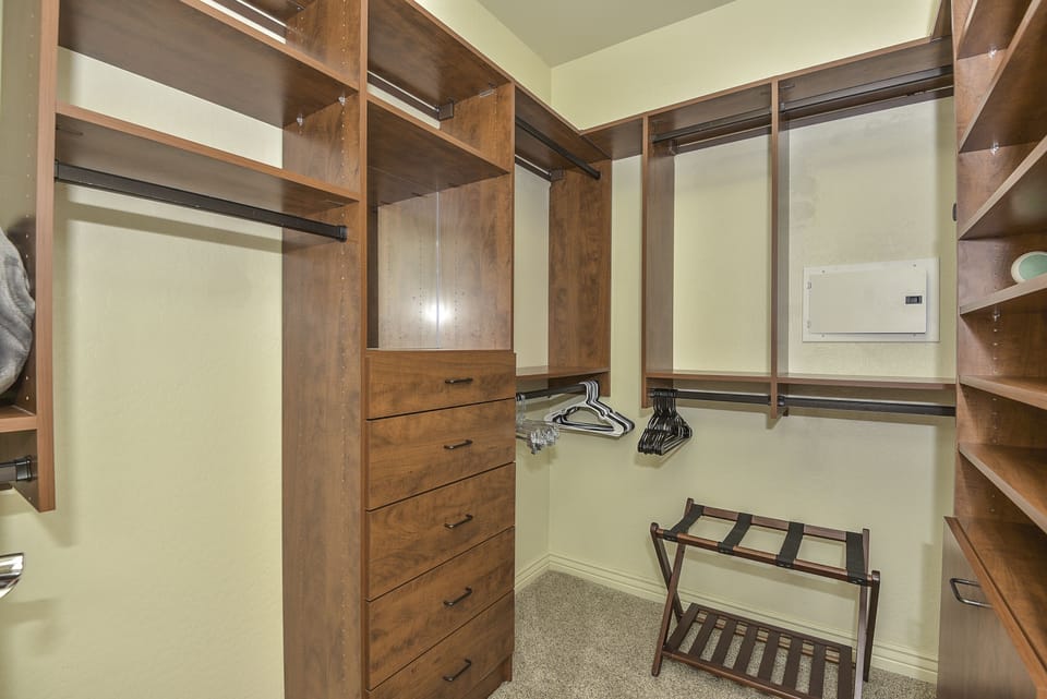 Walk-in closet with professional organizing system.