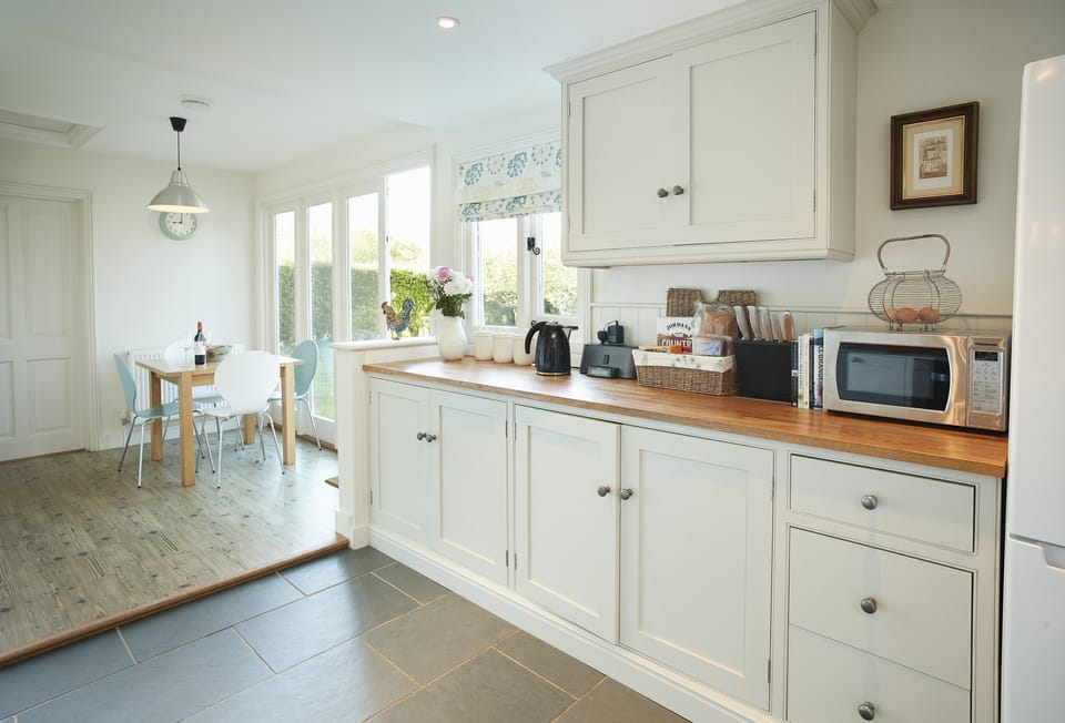 Ground floor: Fully fitted kitchen with separate breakfast area and french doors to garden