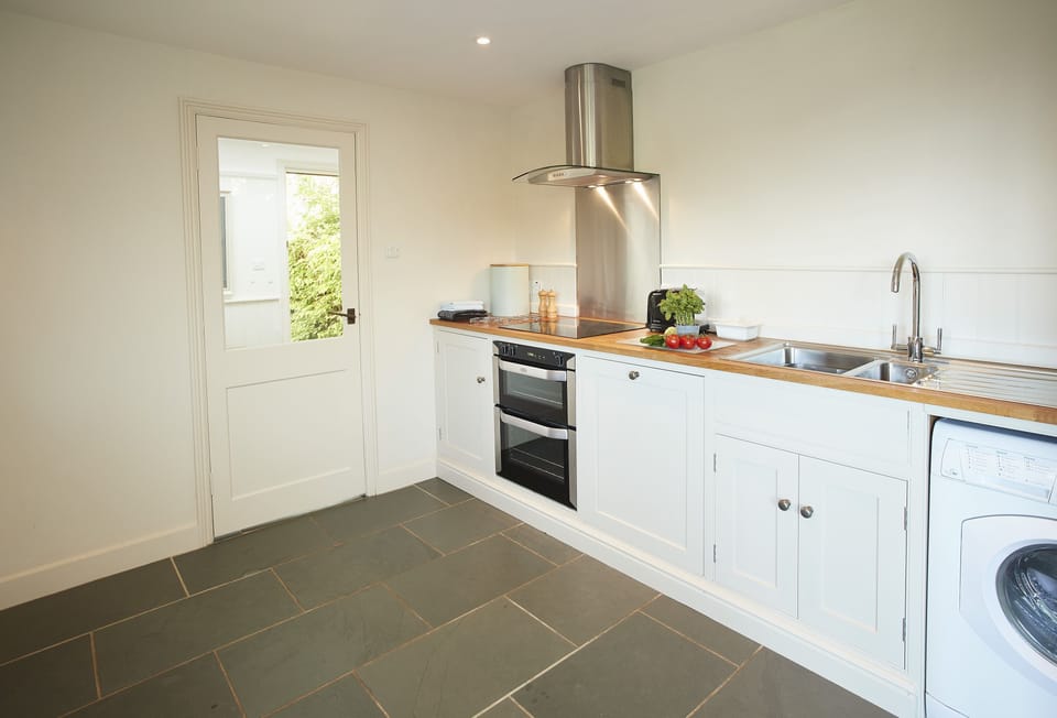 The kitchen with double electric oven and ceramic hob
