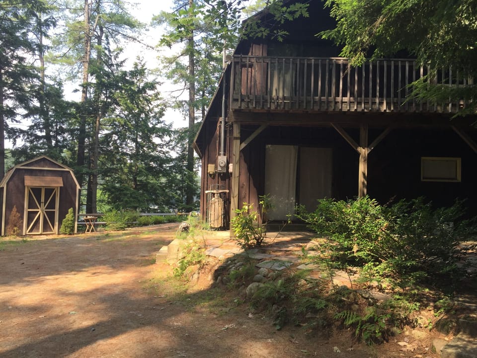 View of front/shed. Two parking spots on side of house - a shared drive