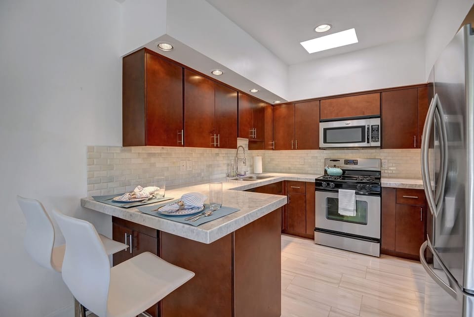 Kitchen with breakfast bar that can be used as a second work space