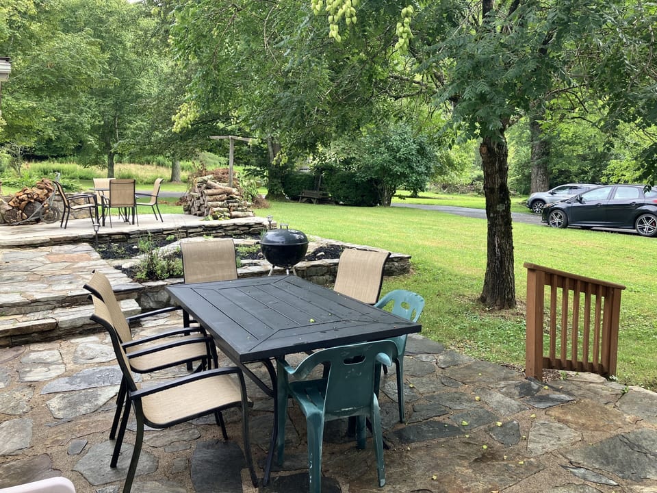 Stone Patio with outdoor seating and yard