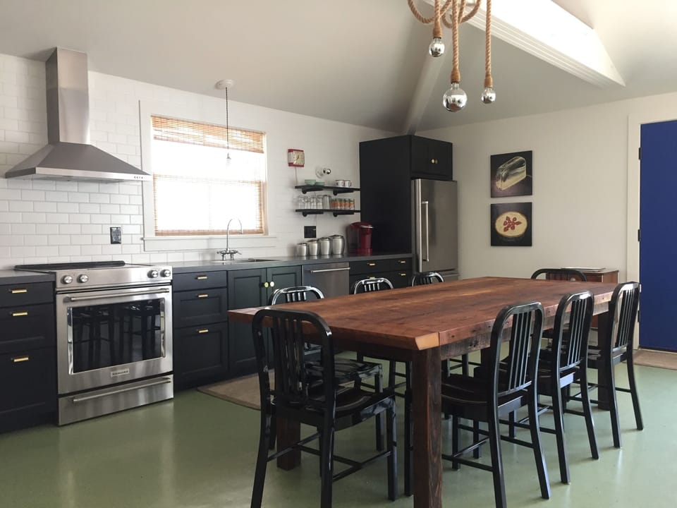 Full kitchen and farm table that seats 8