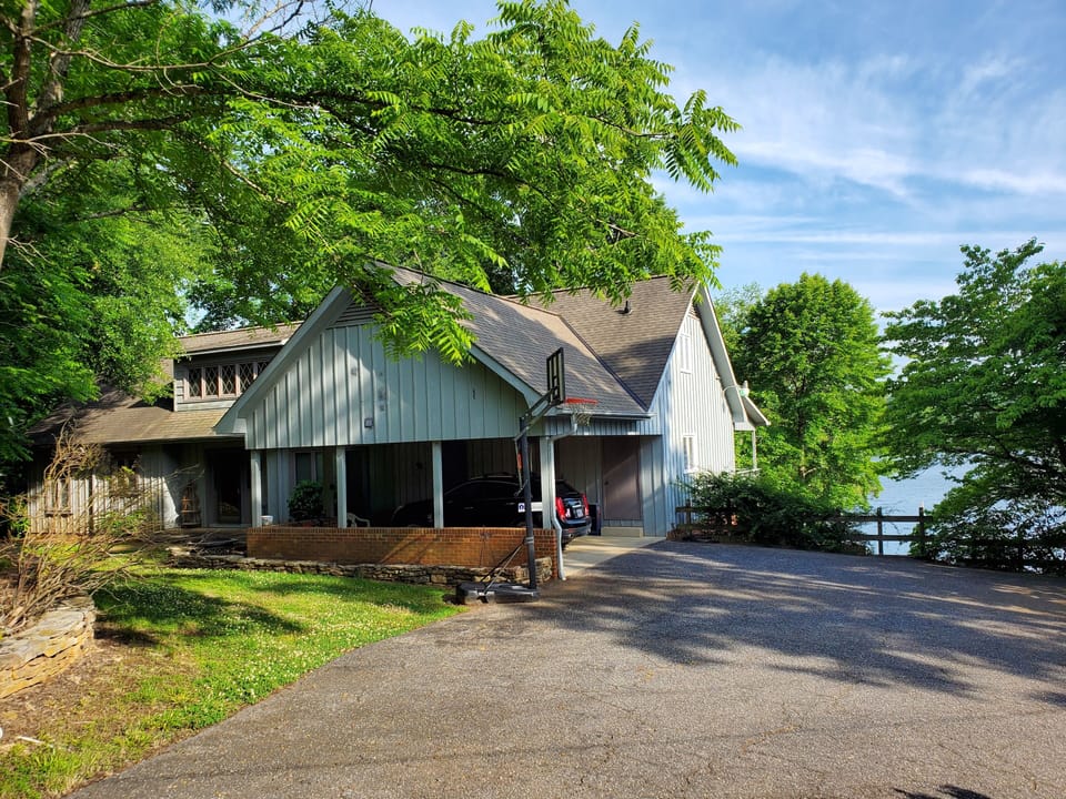 Front View of Home with Plenty of Parking and Basketball Hoop