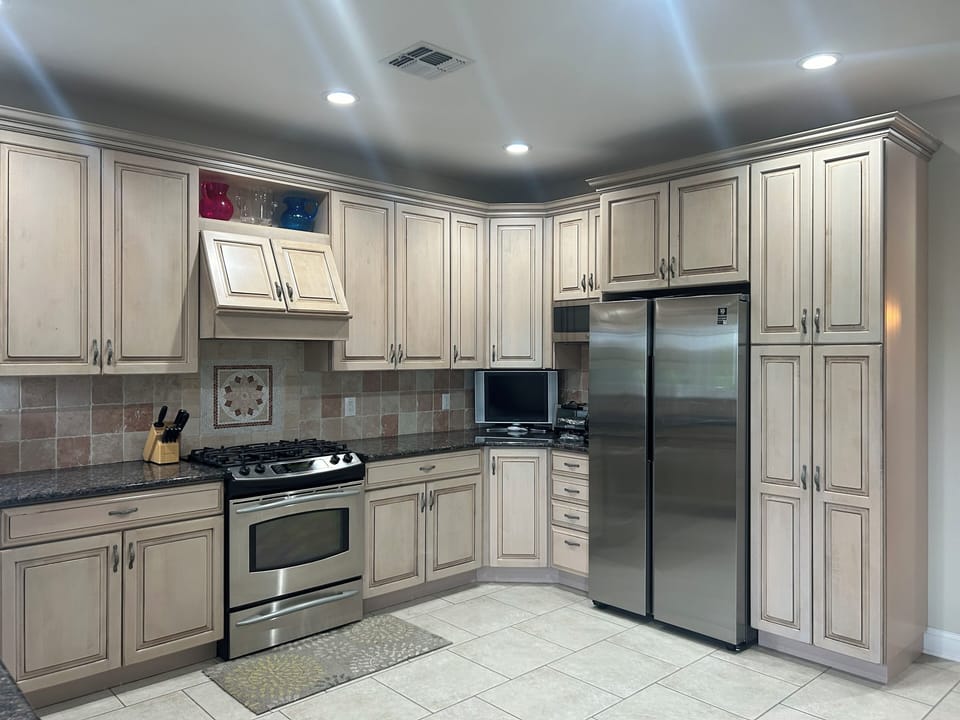 Small tv in kitchen. gas stove