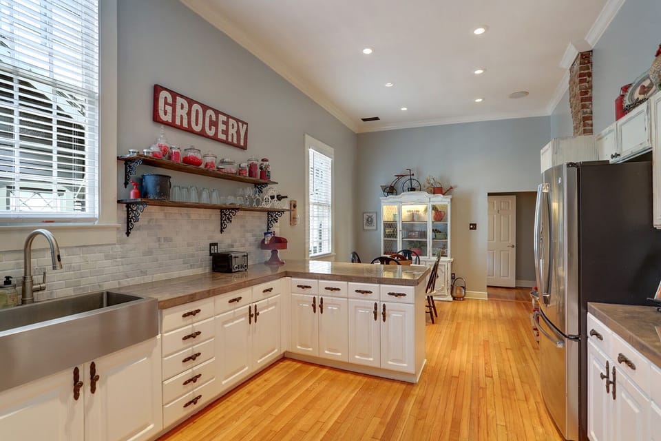 Kitchen with bar stool area and dining set with hutch