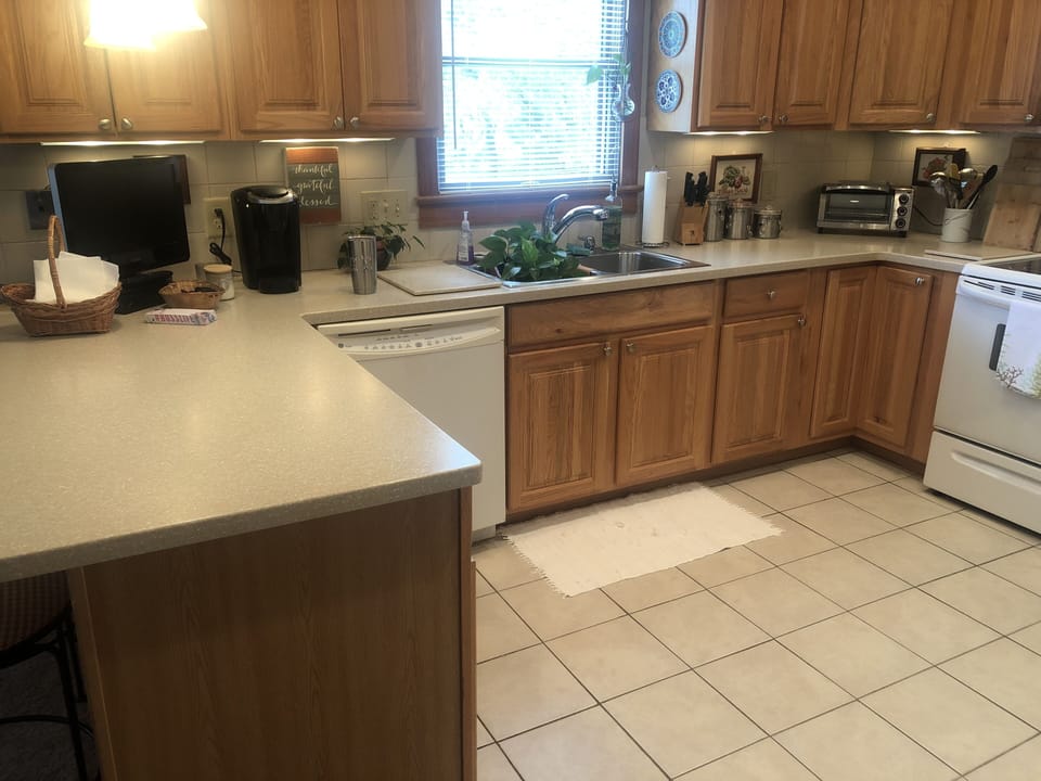 Kitchen, window faces north and looks toward Sound.  Fully stocked with cookware