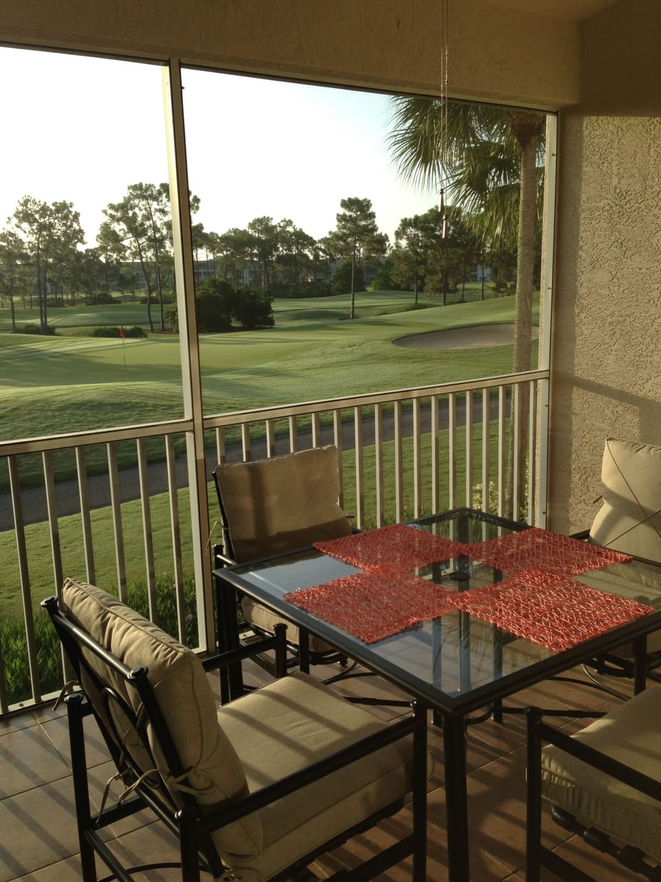 The view of the 5th green from the large lanai with ceiling fan. 