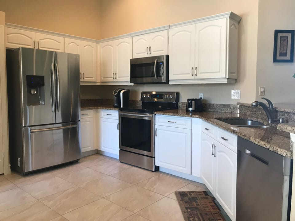 Granite countertops, new stainless steel appliances and ceramic tile 