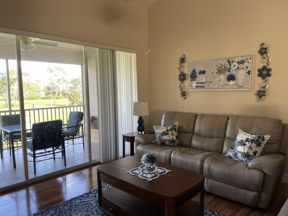 Relax in the living room overlooking the 5th green. 