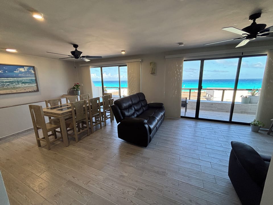 Dining/living area are located upstairs.  Sliding doors lead to patio seating.