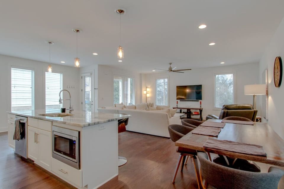 Open-concept living area with kitchen island visible in background