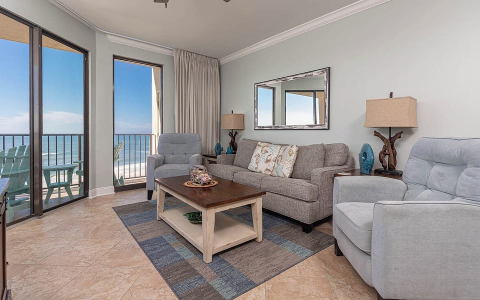 Relax in the inviting living area with plush seating, queen sleeper sofa, and stunning beach views