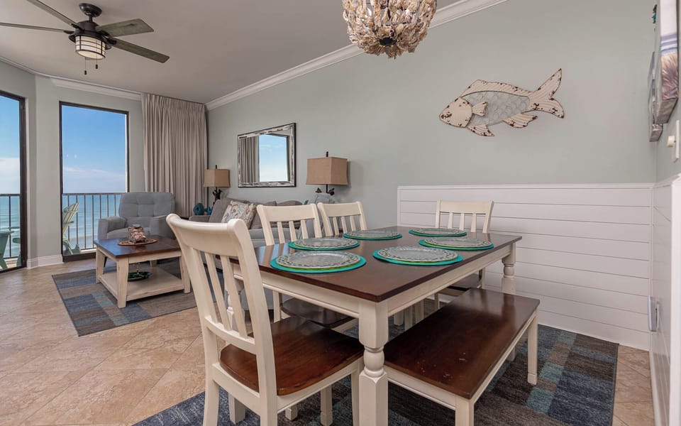 Enjoy meals at the dining table surrounded by coastal decor and beachfront views