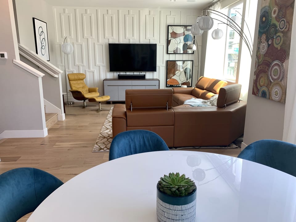 Spacious living & dining area. Couch is also wide enough for sleeping!