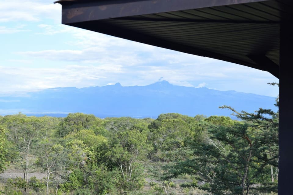 great vegetation and surrounded by mountain ranges and hills.