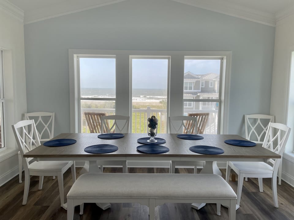 Dining area overlooking beach from beyond